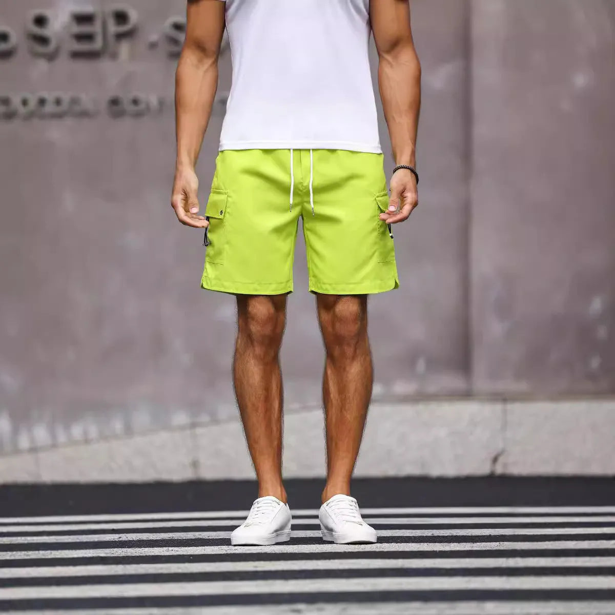 Men's loose fit work shorts in fluorescent green with straight cut design and micro-elastic fabric