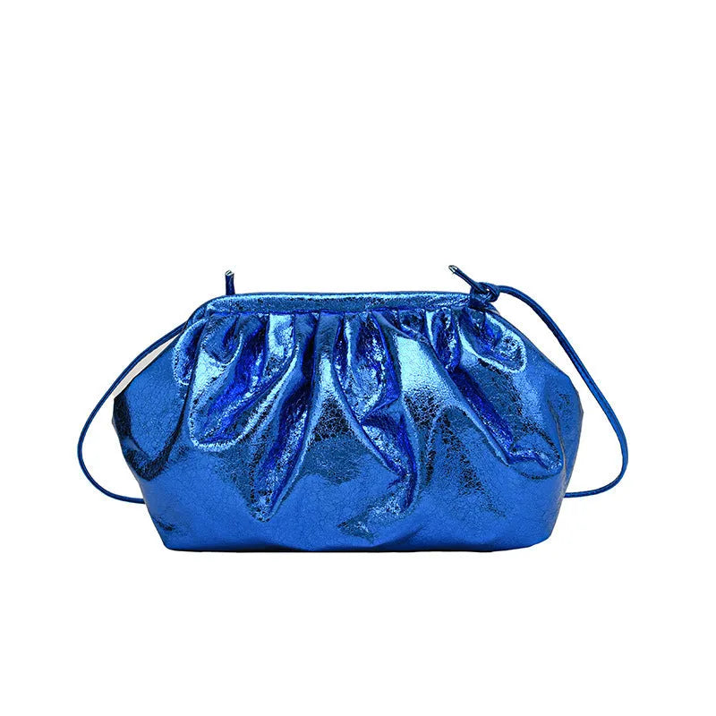 Simple hair clip shoulder crossbody bag in shell shape with sewing line details, shown in rose red colour.