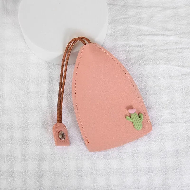 Cartoon pull-out car key case in PU leather with colourful designs measuring 14 x 7.5 cm