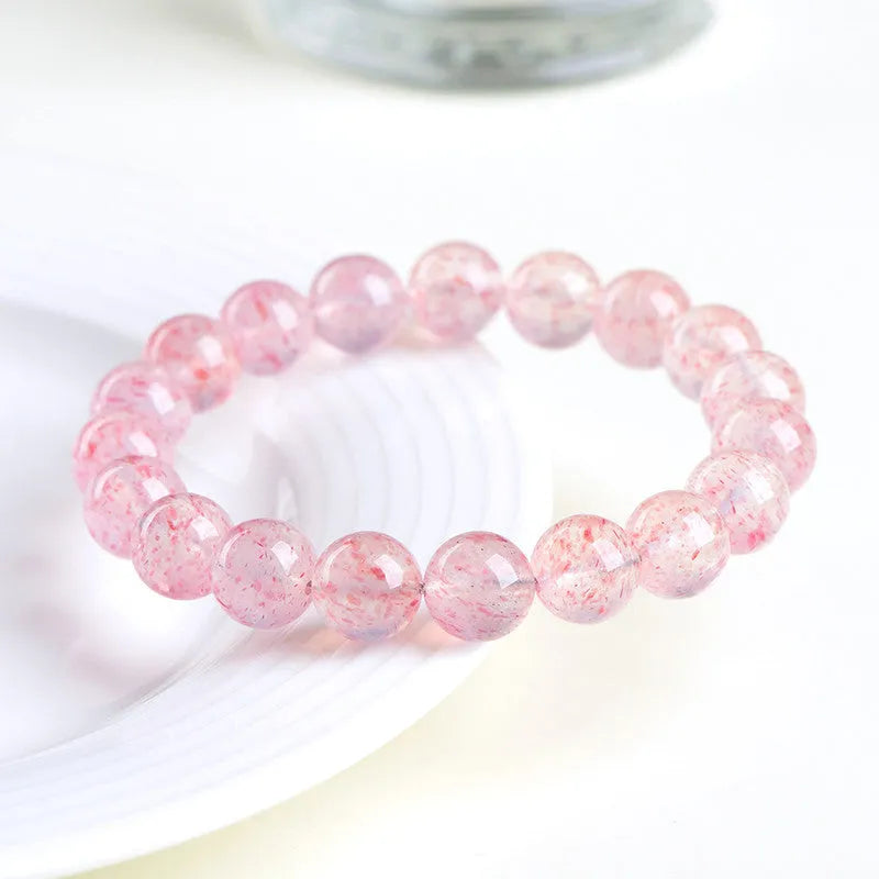 Natural white water strawberry quartz crystal ball bracelet with 10mm geometric beads.