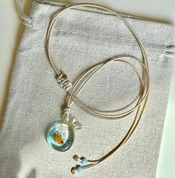 Women's pendant necklace with coloured glaze skirt joker charm on cotton linen clavicle chain