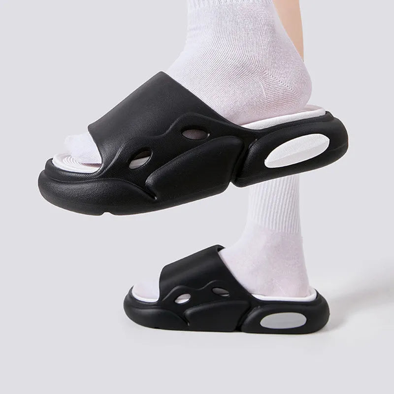 Women's and men's two-colour thick-soled EVA slippers with leather lining on a beach