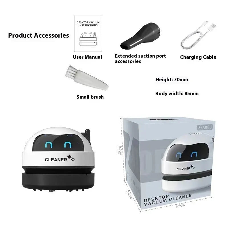 USB charging handheld desktop vacuum cleaner in blue rocket design on computer keyboard