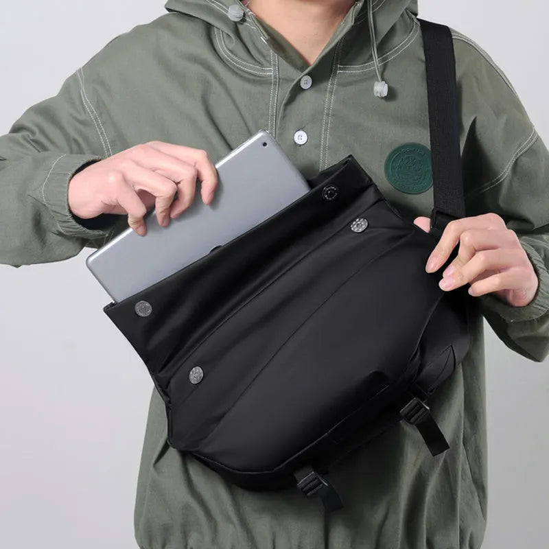 Grey medium square crossbody bag for men showing internal phone and document compartments