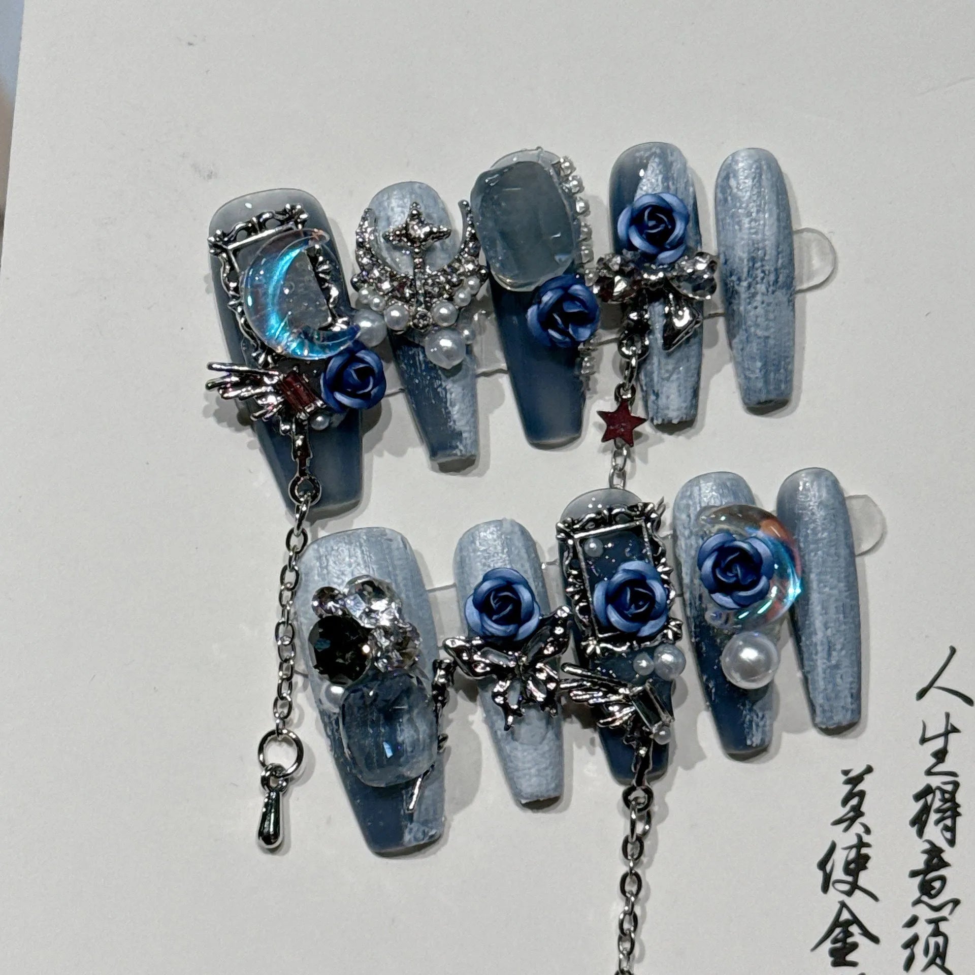 Reusable blue floral press-on nails with rose pattern in sizes XS, S, M, L