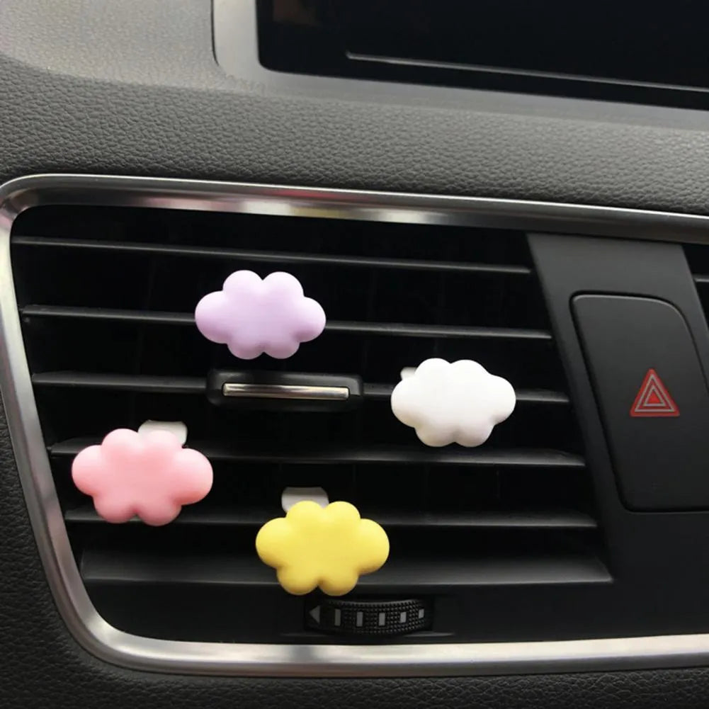 Resin car fragrance clip with Baiyun Cartoon design attached to car air vent