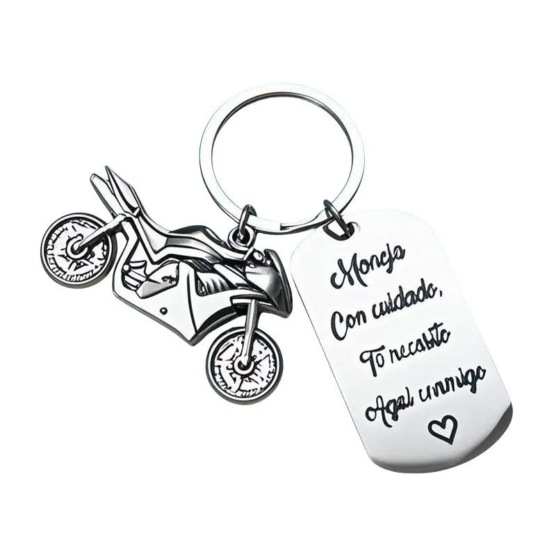 Stainless steel motorcycle keychain on a flannel bag.