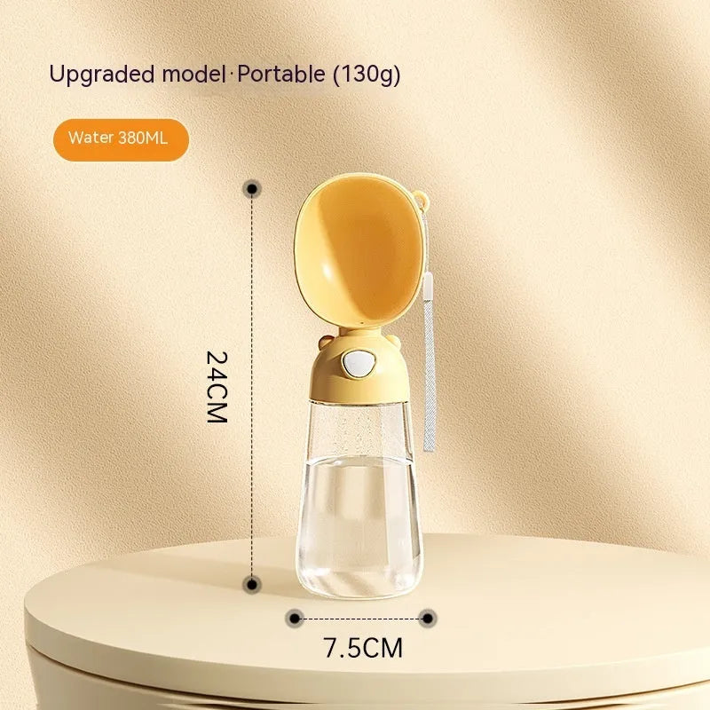 Portable dog water bottle with integrated food container in brown, pink, or yellow colours