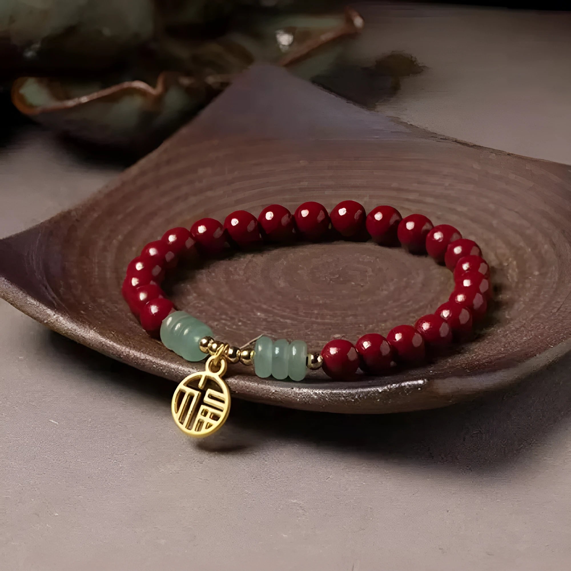 Gold cinnabar and copper bead bracelet in a wave shape on a wrist.