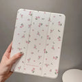 Transparent floral tri-fold tablet case with magnetic stand for iPad showing clear PC back and cartoon pattern