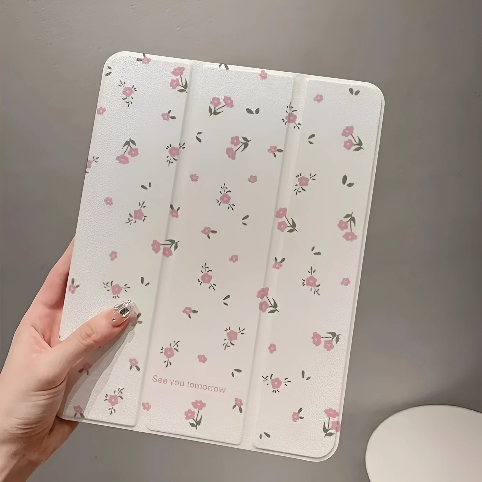 Transparent floral tri-fold tablet case with magnetic stand for iPad showing clear PC back and cartoon pattern
