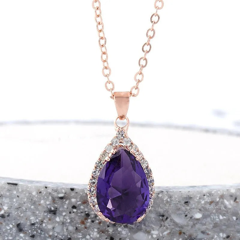 Pink water drop geometric necklace with rose gold electroplating and rhinestone detailing on alloy pendant