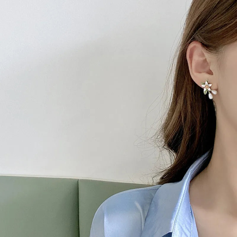 Sterling silver needle camellia earrings with flower ear clip design and contrast colour detailing