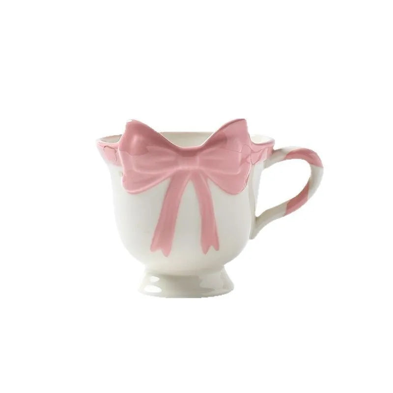 Ceramic mug with heart bow design in Black Pink colour, 301-400ml capacity.