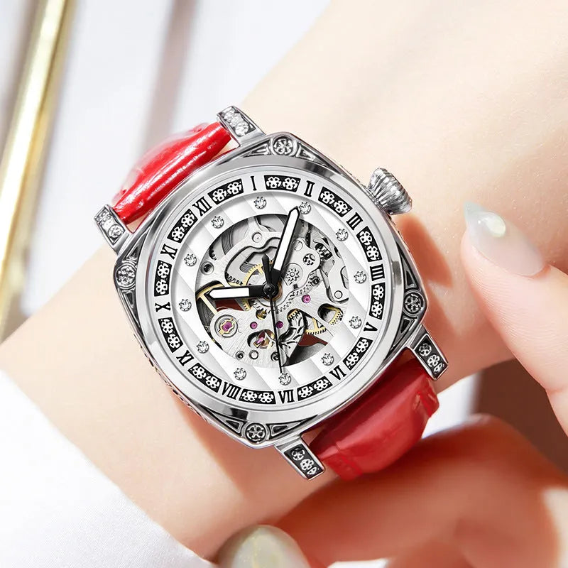 Mechanical watch with luminous hands on a leather strap, stainless steel case, shown in black colour.