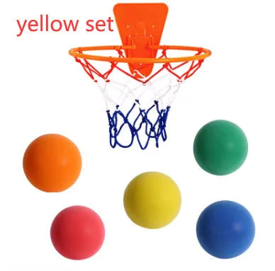 Silent foam basketball training ball in assorted bright colours with basketball hoop