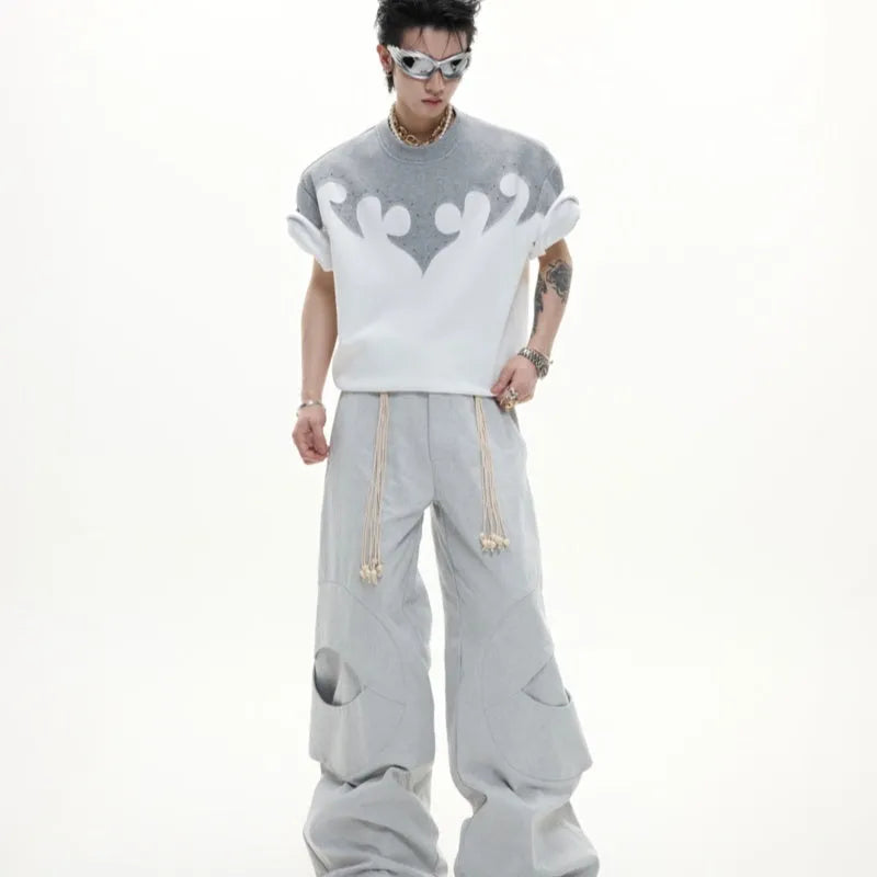 Men's grey cotton T-shirt with burnt flower stitching and rhinestone decoration showing loose fit drop shoulder design