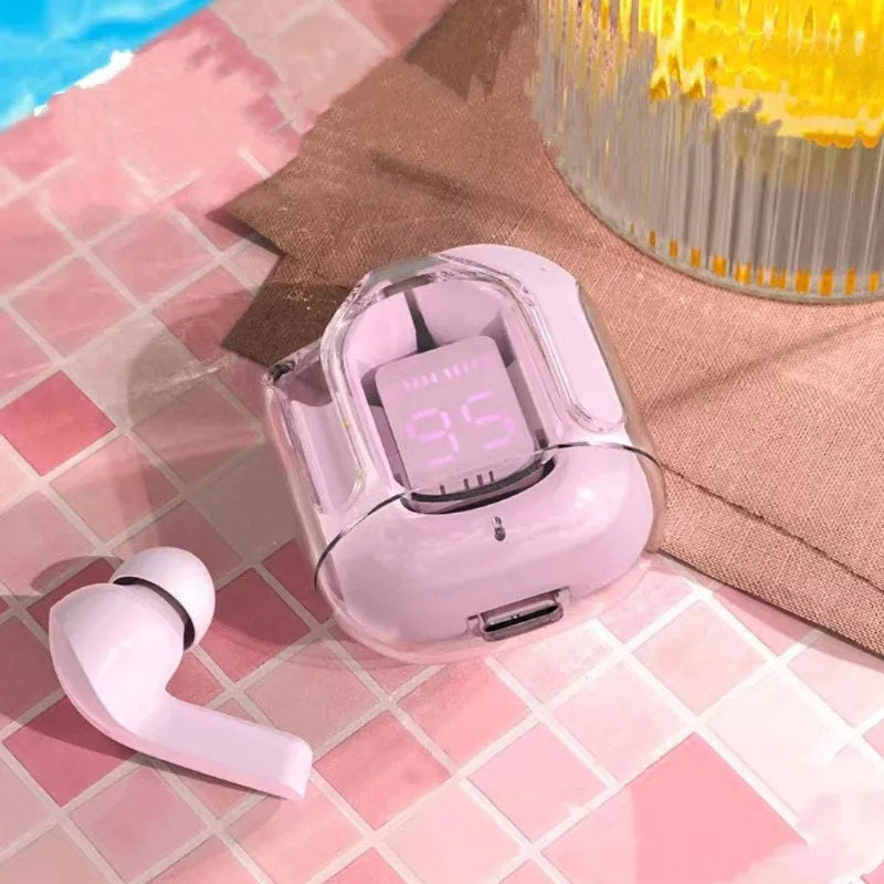 Transparent space capsule shaped case containing true wireless Bluetooth earphones in light blue colour.