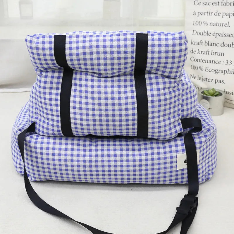 Grey and blue plaid cloth dog travel nest for use in a car, shown in two size options.