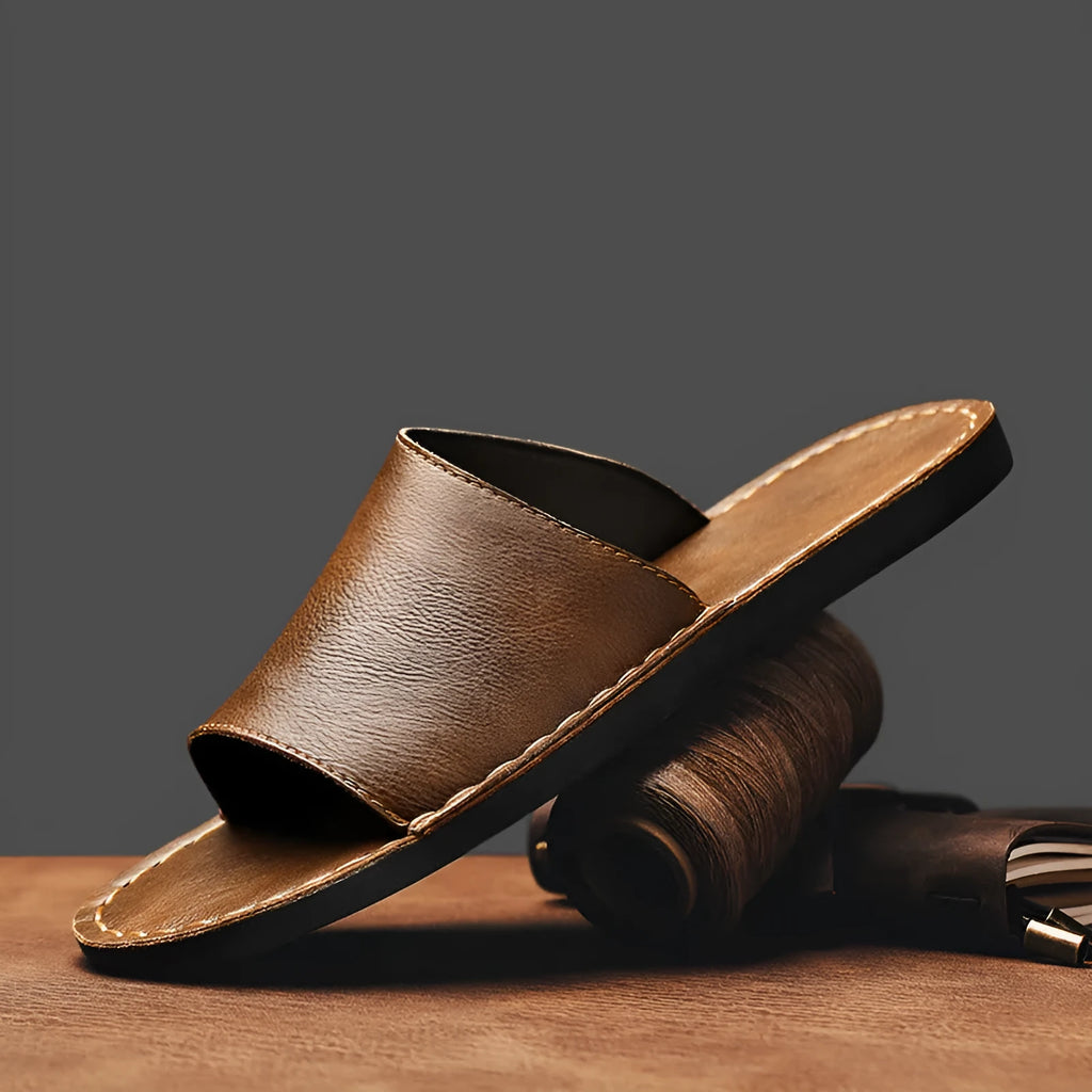Men's brown and black leather sandals with a rubber sole for casual outdoor wear.