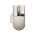 Xiaoqiao tofu colour wireless mouse with seven buttons and a scroll wheel on a desk.