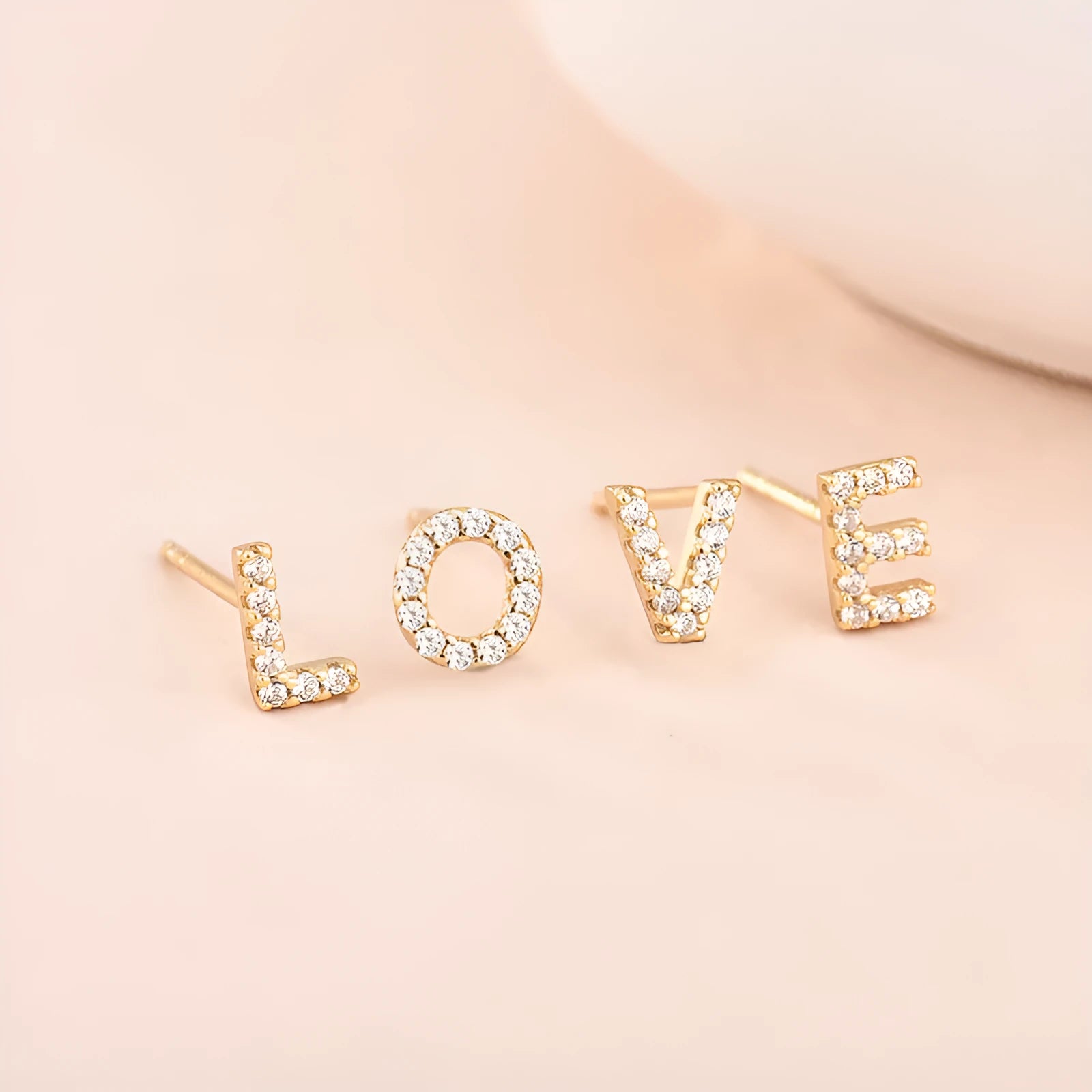 Gold plated English alphabet letter earrings with zircon stone accents on copper base
