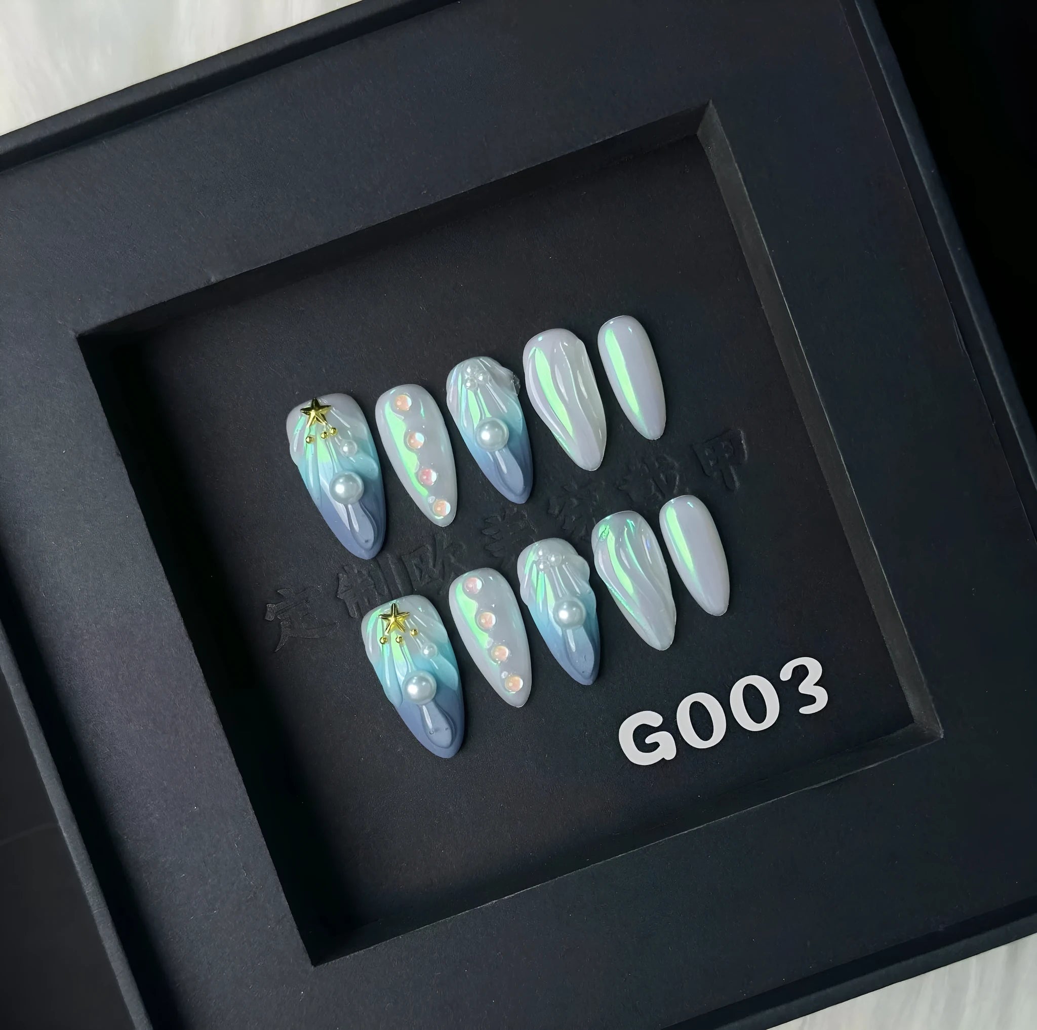 Hailang blue shell design artificial nail tips showing texture and four size options