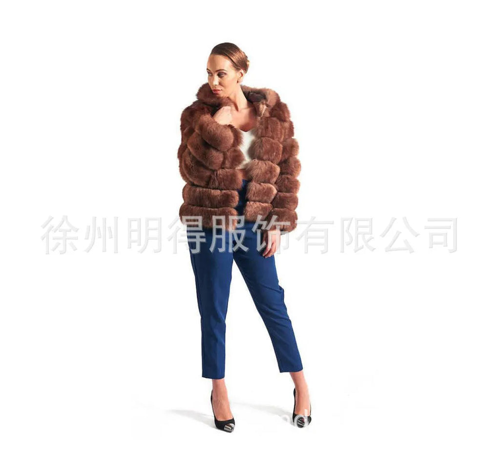 A woman's loose-fitting artificial fur hooded coat in street fashion style.