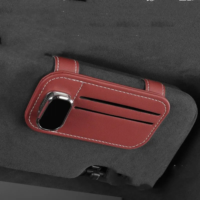 Beige leather car sun visor card holder with a glasses clip shown installed on a vehicle visor.