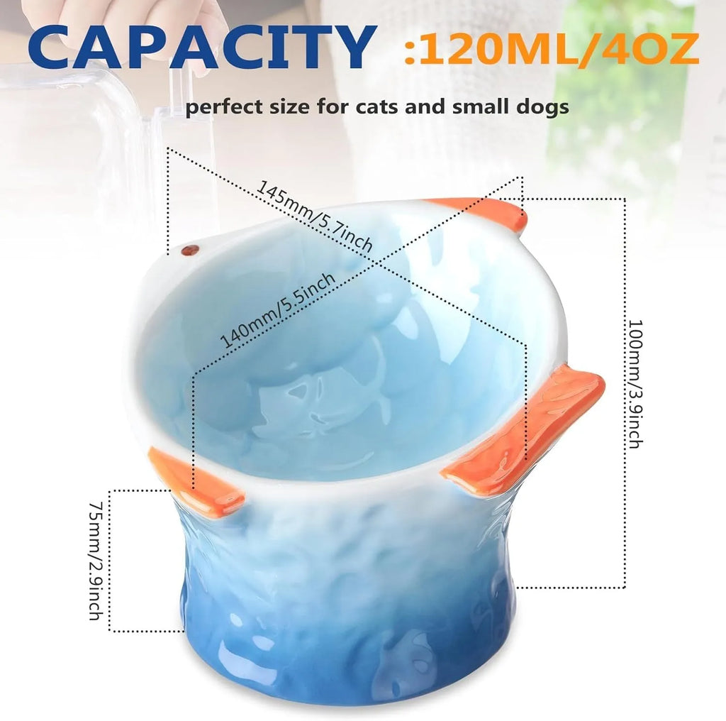 Four fish-shaped ceramic cat bowls in assorted colours with elevated design and tilted angle