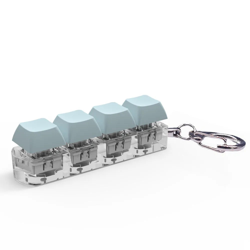 4-key mechanical keyboard switch tester with transparent bottom shell on desk