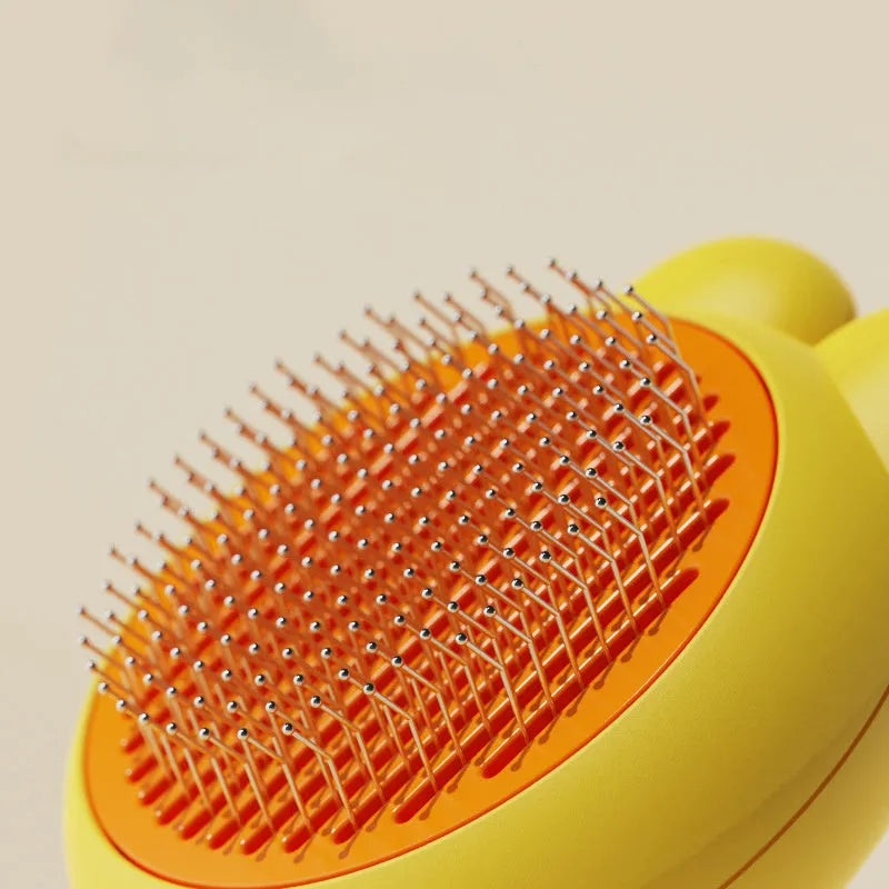 Self-cleaning pet grooming brush in green with stainless steel comb and release button.