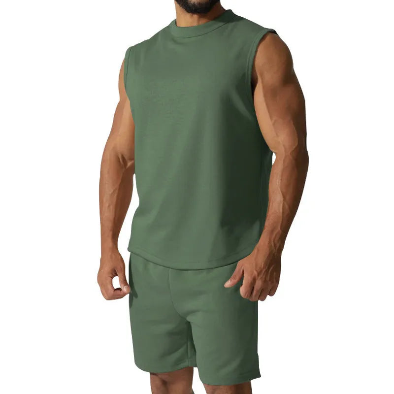 Men's sleeveless cotton blend sports top and shorts set in a solid colour.