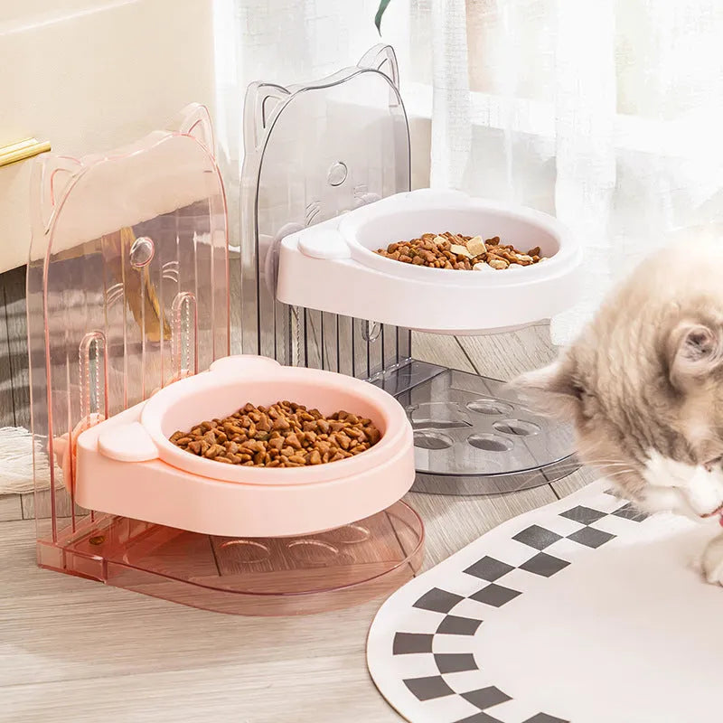 Grey cat ear design pet bowl with removable hanging cage attachment on white background