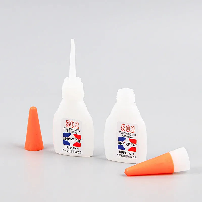 Instant strong shoe repair adhesive in 3G and 8G sizes with application tool