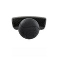 Black silicone steering wheel assist ball with metal bearing booster on a car steering wheel.