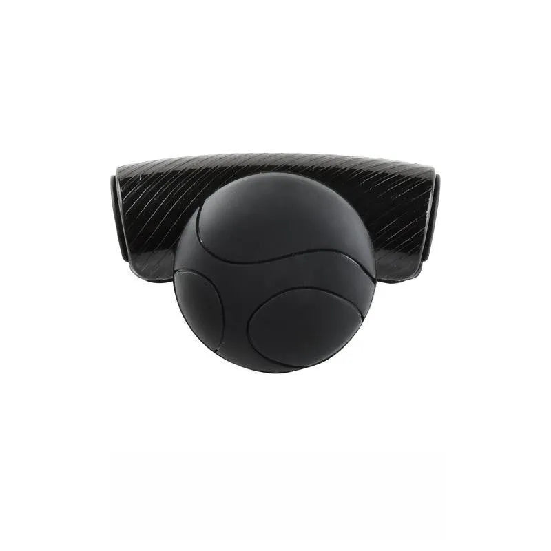 Black silicone steering wheel assist ball with metal bearing booster on a car steering wheel.