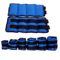 A pair of Oxford cloth legging sandbags for track and field running, showing adjustable weight options.