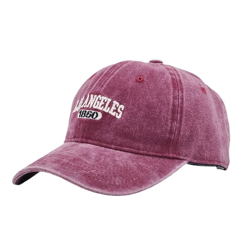 Retro adjustable peaked cap with distressed embroidery in conical crown design