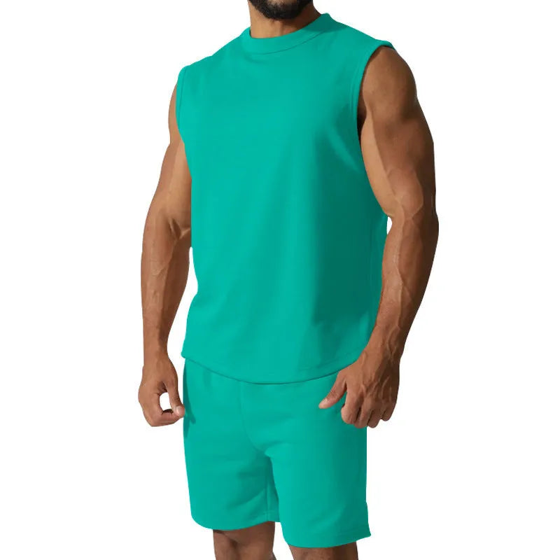 Men's sleeveless cotton blend sports top and shorts set in a solid colour.