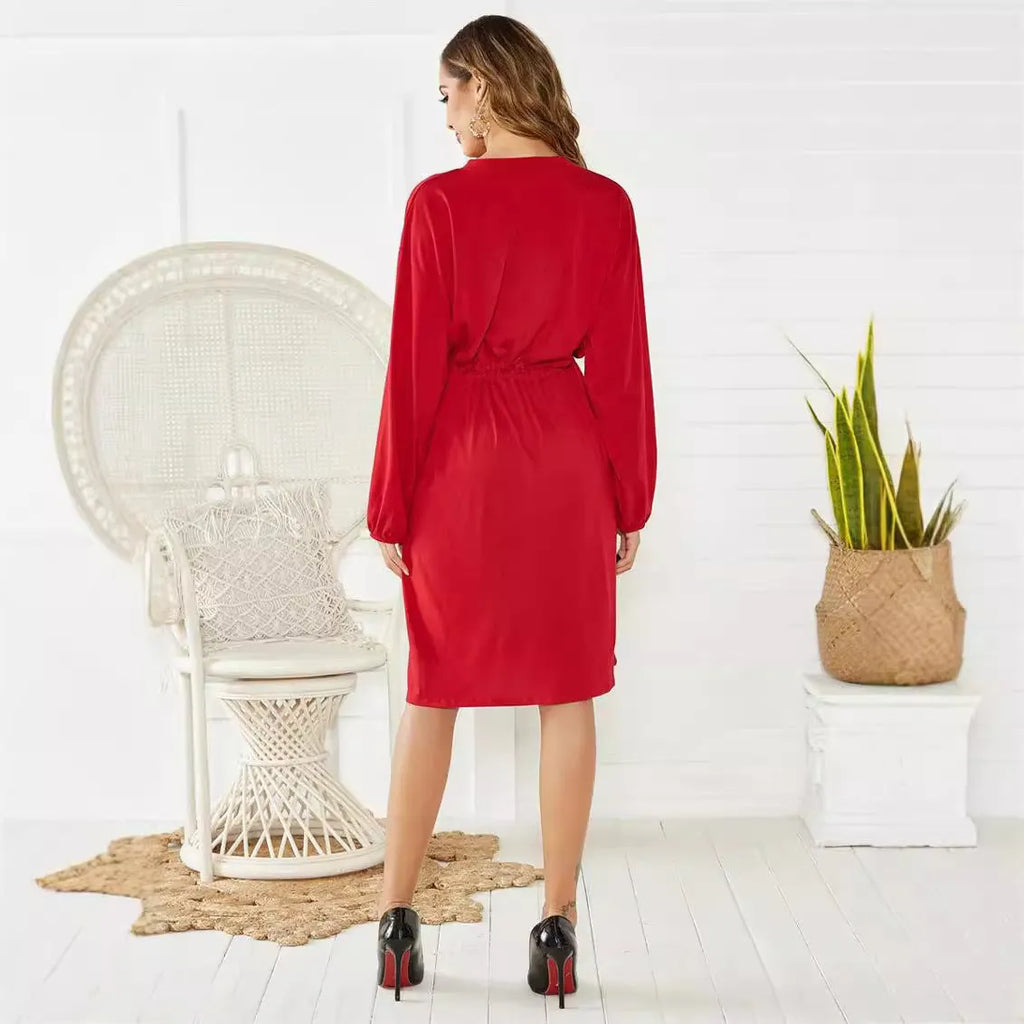 Women's black elastic waist A-line dress with cinched belt and long sleeves