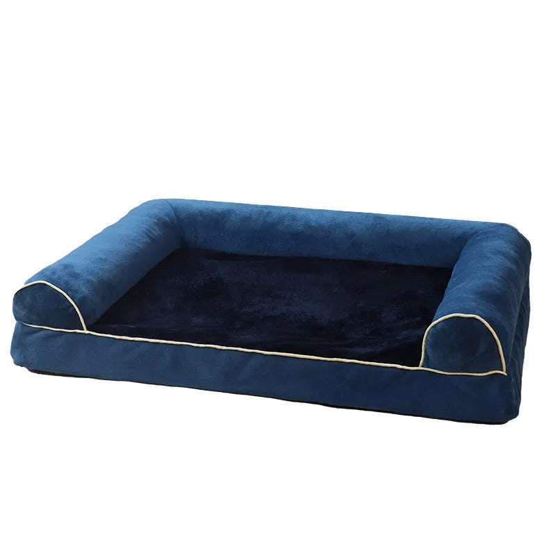 A square, cloth-covered sponge dog bed shown in blue, with a dog resting on it.