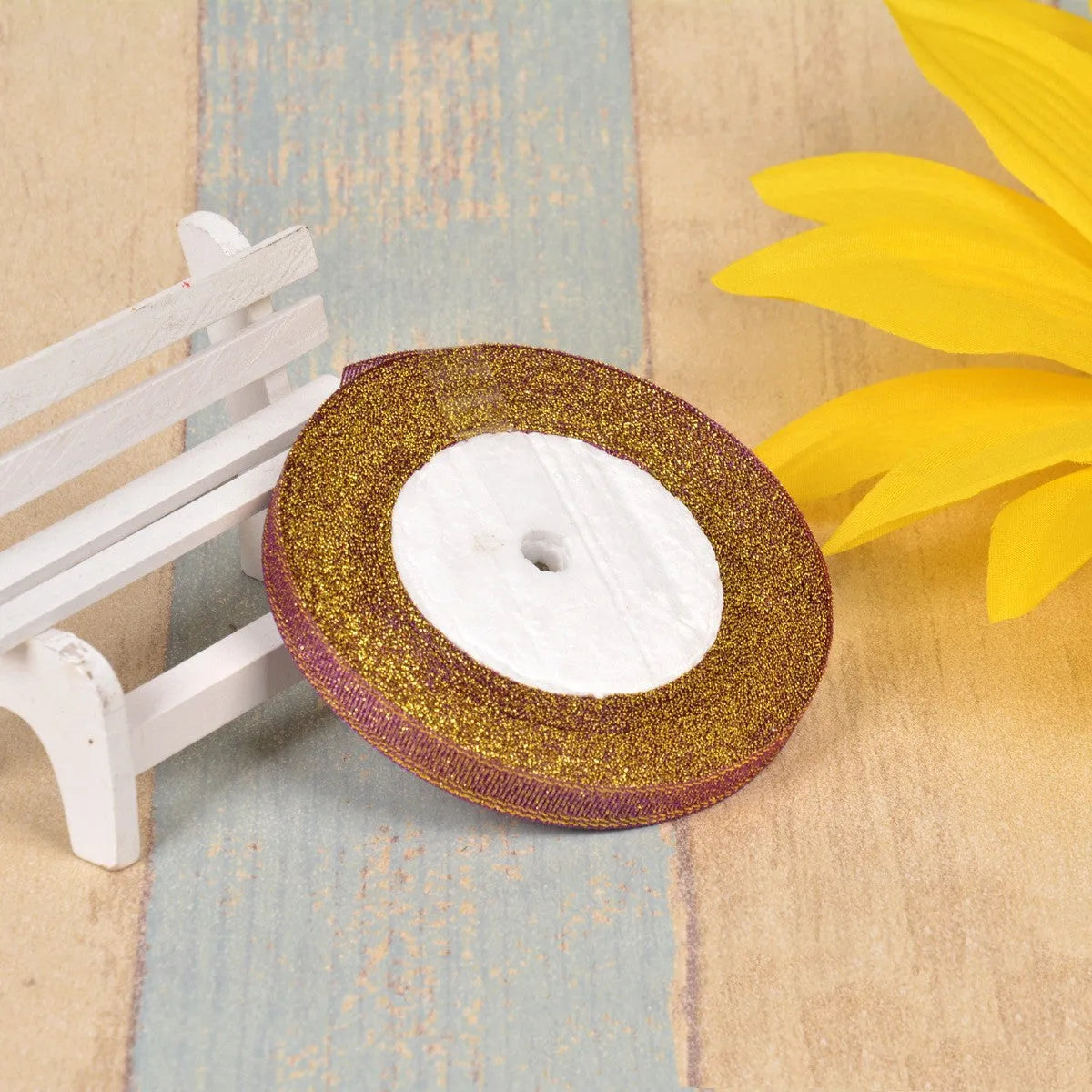Polyester ribbon spool in metallic colours for decorative clothing and gift packaging trim