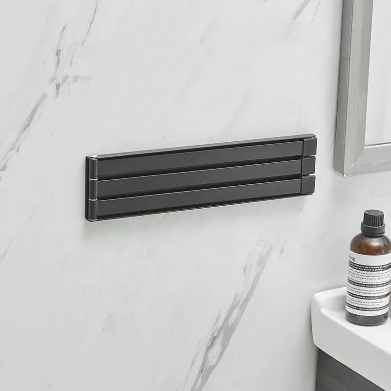 Nordic folding towel bar in black or white with carbon steel anti-rust construction for no-drill bathroom installation