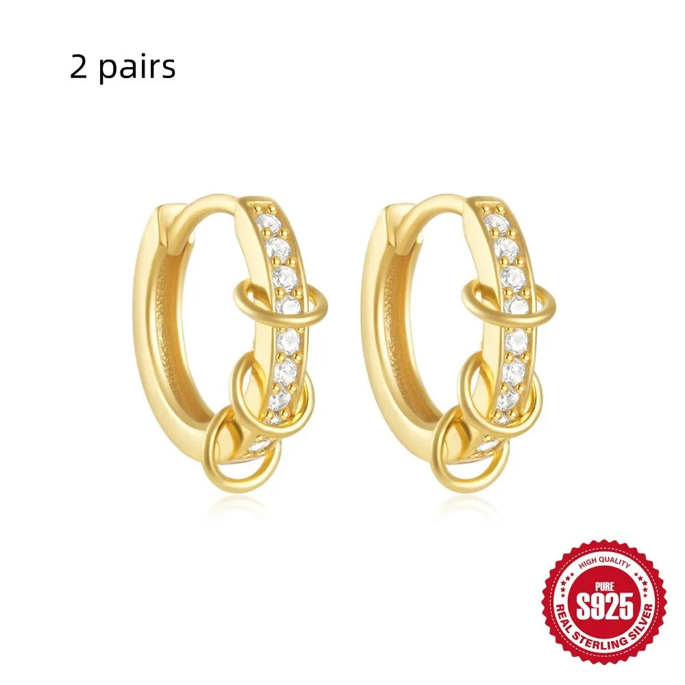 Sterling silver geometric stud earrings with small round diamond detailing in gold and silver electroplated finishes