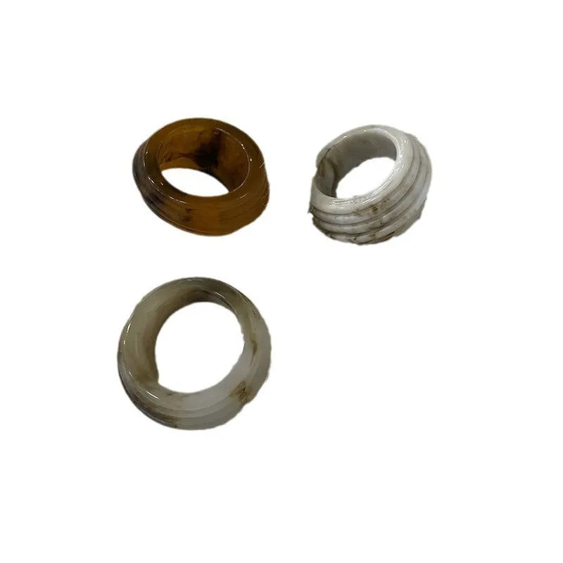 Geometric Chinese style resin ring in brown or white colour with irregular width design