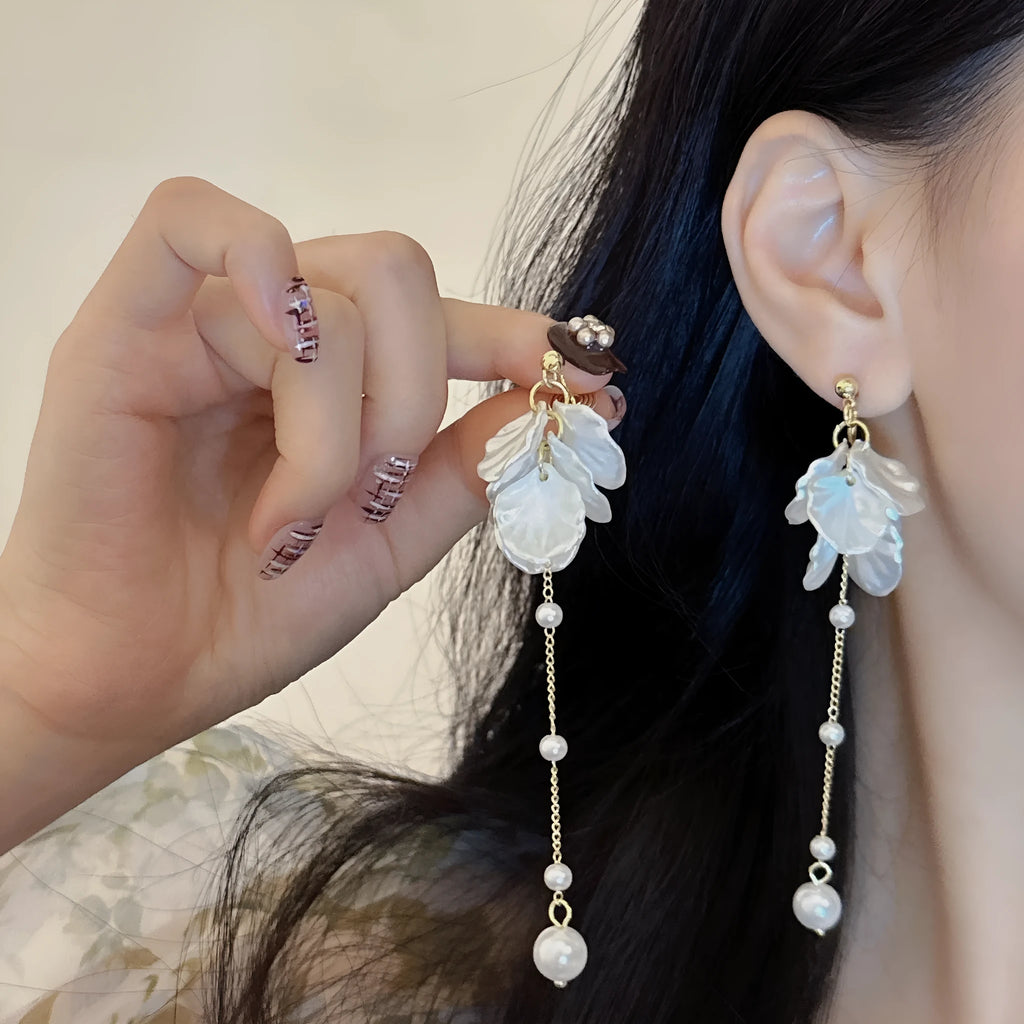 Women's acrylic shell pearl tassel earrings showing four different clip style options