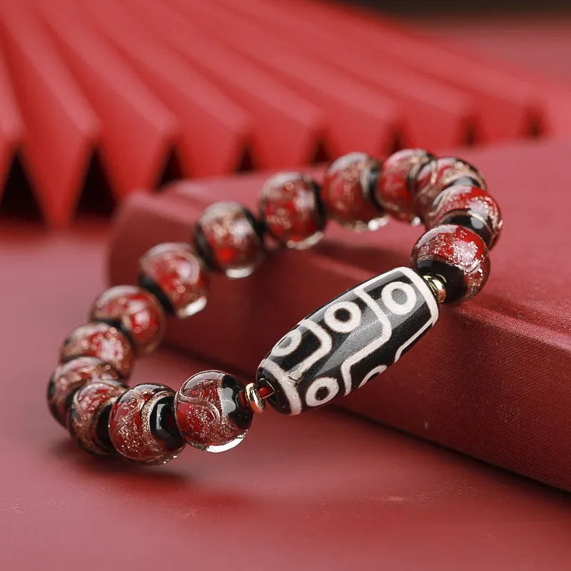 Chinese-style coloured glaze bracelet with five-colour design and Year of the Snake lucky beads.