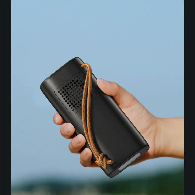 Black portable power bank with 20000mAh capacity and 220V output for outdoor use