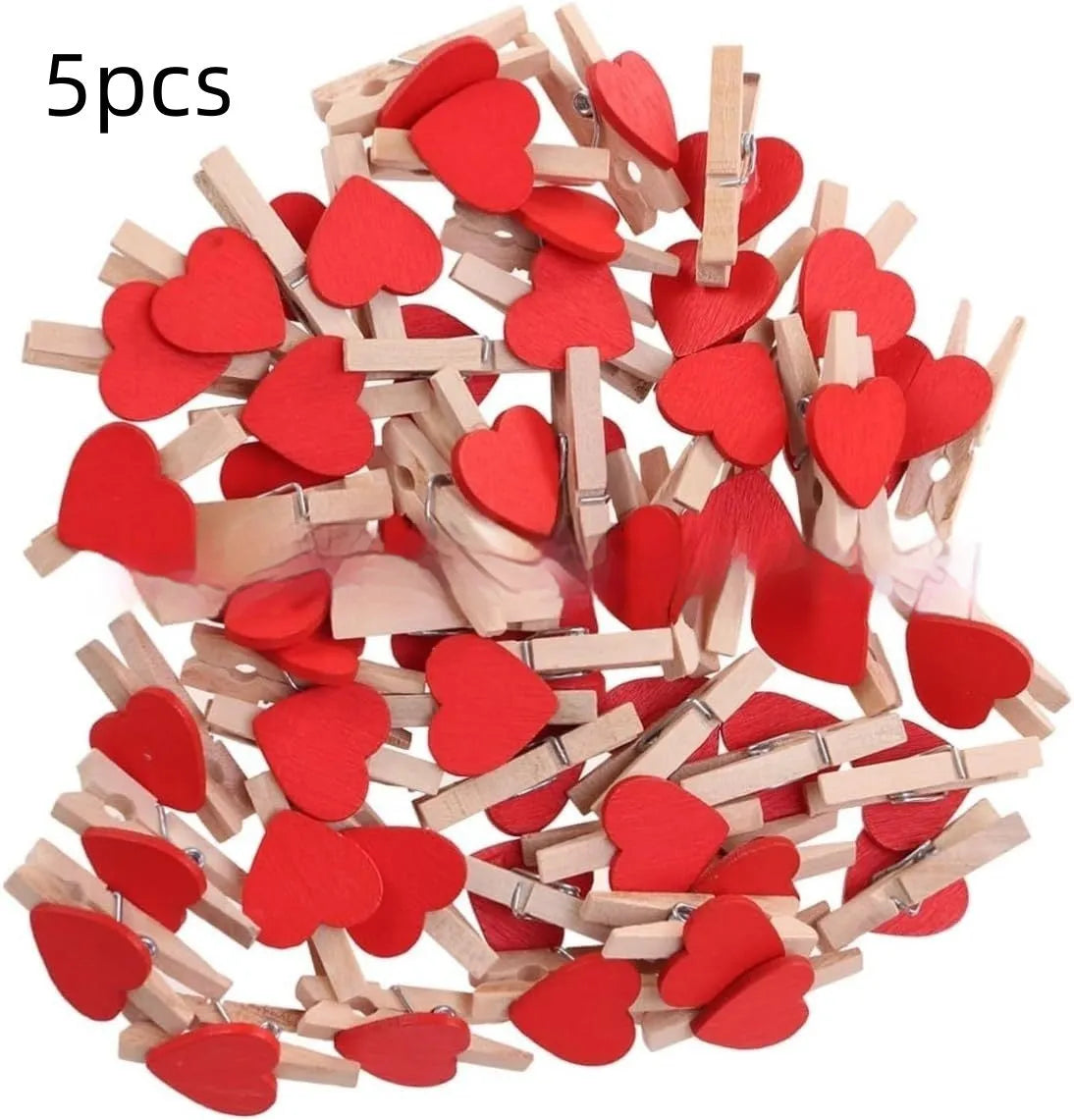 Five small handmade solid wood heart-shaped clips in assorted colours on a white surface.